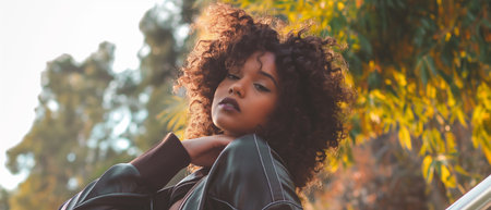 Beautiful african american woman with afro hairstyle outdoorsの素材