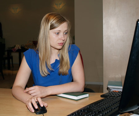 Young woman is working in the office