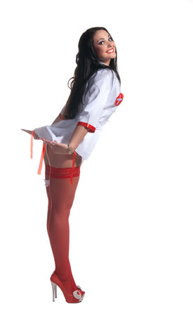 This is a sexy nurse in red stockings and a short medical gown.の写真素材