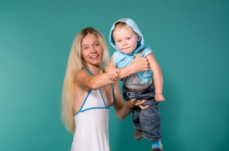 Laughing mother throws up her sonの写真素材