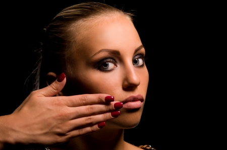 portrait of sexy girl with aggressive makeup on black backgroundの写真素材