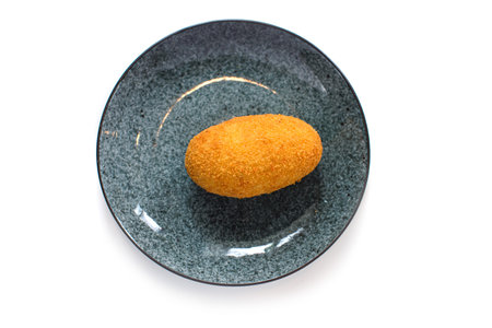 Kiev cutlet on ceramic plate on white background