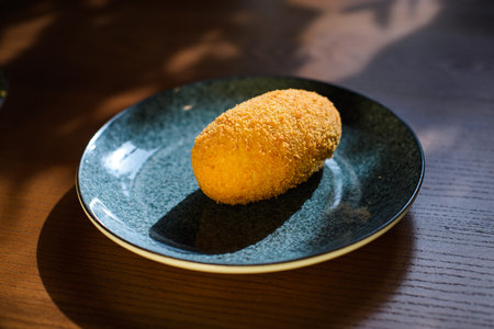 Kiev cutlet on ceramic plate on tableの写真素材