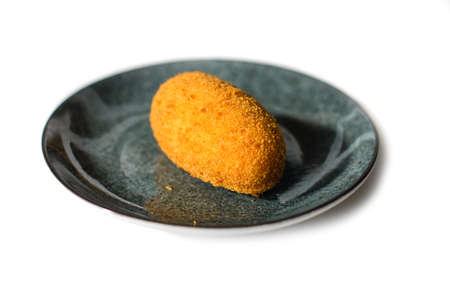 Kiev cutlet served on gray ceramic plate on white backgroundの写真素材