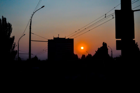 construction site silhouetted at sunset