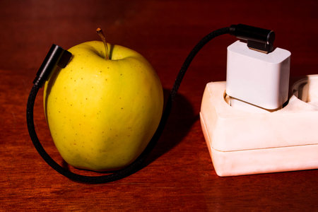 Apple is charging from the outlet.