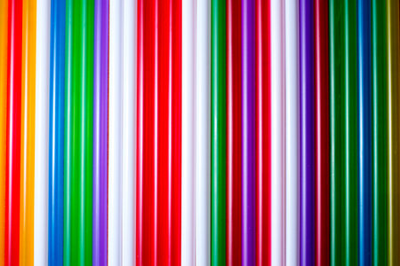 Colorful background, tubules for a cocktail.