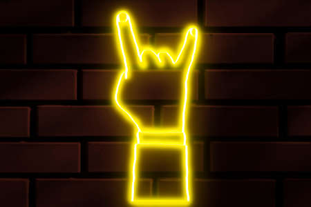 Goat neon sign on a dark brick wallの写真素材