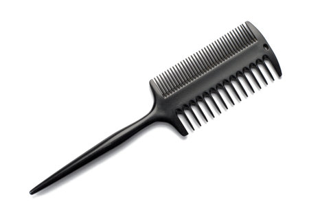Black hairbrush on a white isolated background.