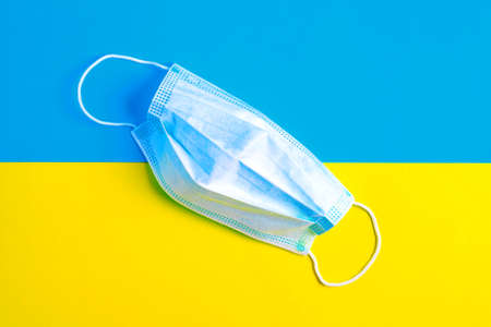 Protective face mask on the flag of Ukraine.の写真素材
