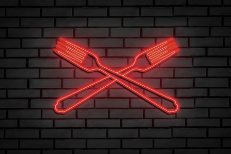 Neon sign in the form of crossed forks on a brick wall