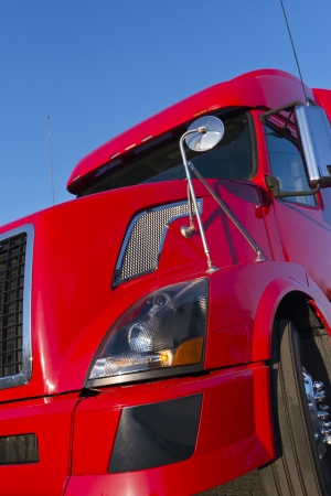 Modern Semi truck in red color on the blue sky の写真素材
