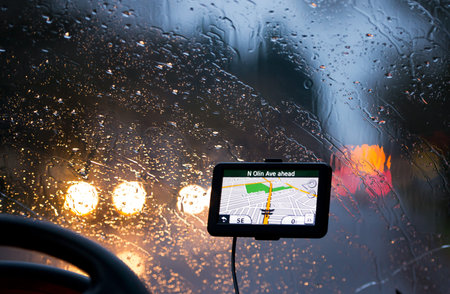 GPS Navigator with a map of the city with streets and roads in night mode display screen on the...