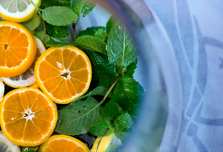 Delicious healthy exotic nature refreshing drink with mint and lemon have a wonderful taste and a light aroma of mint and citrus create an excellent atmosphere of celebration and relaxation at the same timeの写真素材