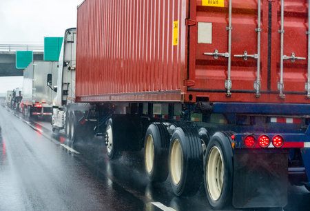 Convoy of different big rigs semi trucks with commercial cargo in semi trailers and container...