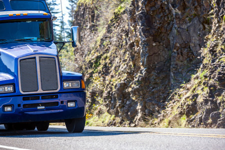 Classic big rig professional industrial grade American bonnet blue transportation semi truck tractor...