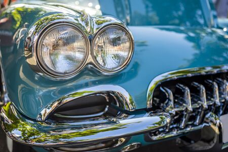 Fancy turquoise vintage retro car attracting the attention of visitors and amateurs of antiquity not only in the carâs excellent condition and shape but also unique applied engineering solutionsの写真素材