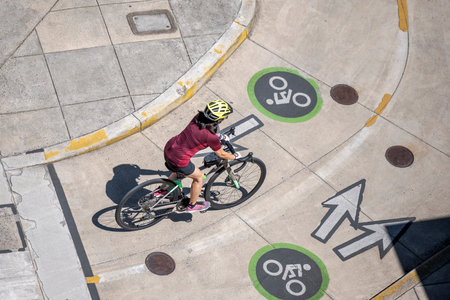 A woman on bicycle and cycling rides are great tools for improving health of the muscles of the hip belt reducing weight and improving female libido improving psychological stability in lifestyleの写真素材