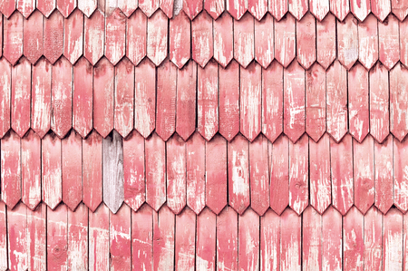 Wall decorated with old red wooden planks texture backgroundの写真素材