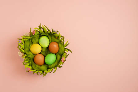 the hare's ears are white on a black background the child hid behind a pink background for the inscriptionの写真素材