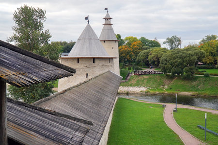 Pskov. Russia. Stone Kremlin in the city of Pskov. 09.17.2021. Orthodox church in a stone fort. The bell tower of the Trinity Cathedral. Pskov Kremlin on a summer day. Museums of Russia.のeditorial素材