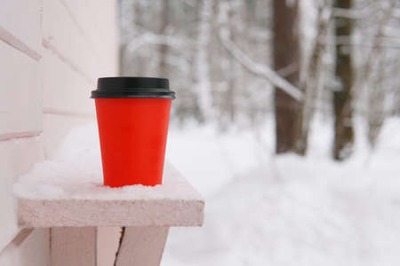 red paper cup for coffee against pink wooden wall. close up. valentines dayの写真素材