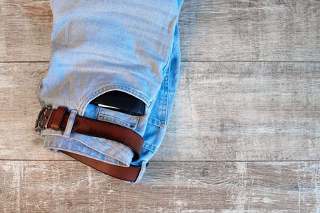 banknotes in jeans pocket in your wallet. The concept of wealth and salary for work.