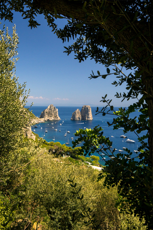 view of the faraglioni from the island of Capri in Italyの写真素材