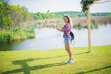 Woman making selfie on the park in a sunday.のeditorial素材
