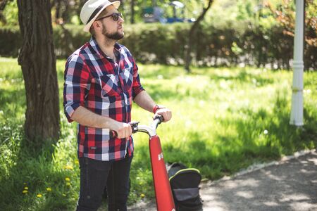 BUCHAREST, ROMANIA, - October 26, 2017: Person using smart watch and a smartphone walking on the park in a sunday. Young man making gestures on a wearable smart watch. Illustrative editorial content.のeditorial素材