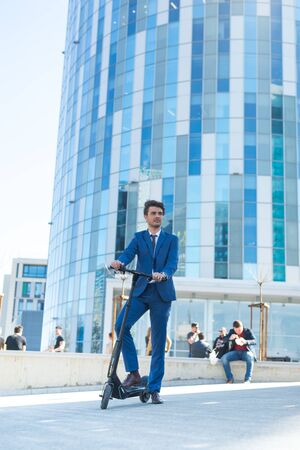BUCHAREST, ROMANIA, - Octomber 26, 2017: Using Electric Scooter on the street on a sunny day with sarf effect and blurry. Editorial content.のeditorial素材