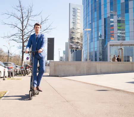 BUCHAREST, ROMANIA, - Octomber 26, 2017: Using Electric Scooter on the street on a sunny day with sarf effect and blurry. Editorial content.のeditorial素材