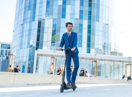 BUCHAREST, ROMANIA, - Octomber 26, 2017: Using Electric Scooter on the street on a sunny day with sarf effect and blurry. Editorial content.のeditorial素材