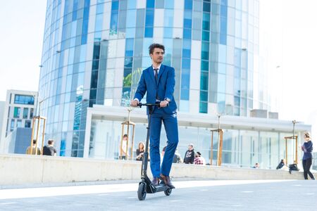 BUCHAREST, ROMANIA, - Octomber 26, 2017: Using Electric Scooter on the street on a sunny day with sarf effect and blurry. Editorial content.のeditorial素材