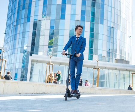 BUCHAREST, ROMANIA, - Octomber 26, 2017: Using Electric Scooter on the street on a sunny day with sarf effect and blurry. Editorial content.のeditorial素材