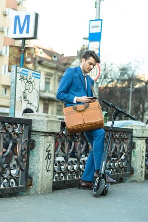 BUCHAREST, ROMANIA, - Octomber 26, 2017: Using Electric Scooter on the street on a sunny day with sarf effect and blurry. Editorial content.のeditorial素材