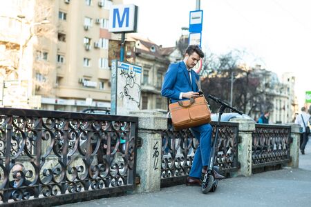 BUCHAREST, ROMANIA, - Octomber 26, 2017: Using Electric Scooter on the street on a sunny day with sarf effect and blurry. Editorial content.のeditorial素材