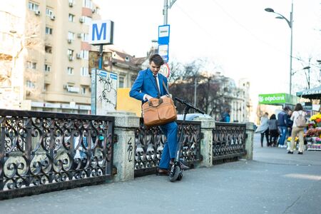 BUCHAREST, ROMANIA, - Octomber 26, 2017: Using Electric Scooter on the street on a sunny day with sarf effect and blurry. Editorial content.のeditorial素材