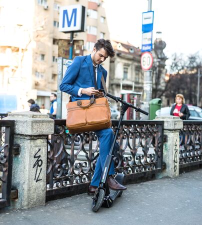 BUCHAREST, ROMANIA, - Octomber 26, 2017: Using Electric Scooter on the street on a sunny day with sarf effect and blurry. Editorial content.のeditorial素材