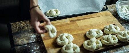 Dough dainted by the woman on the boardの写真素材