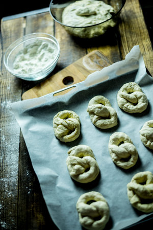 Dough dainted by the woman on the board