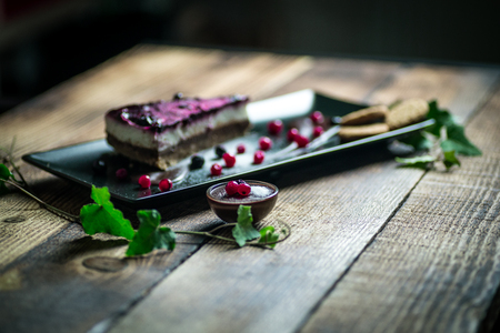 Homemade cheesecake with fresh berries and chocolate for dessert - healthy organic summer dessert pie cheesecake.の写真素材