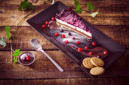Homemade cheesecake with fresh berries and chocolate for dessert - healthy organic summer dessert pie cheesecake.の写真素材