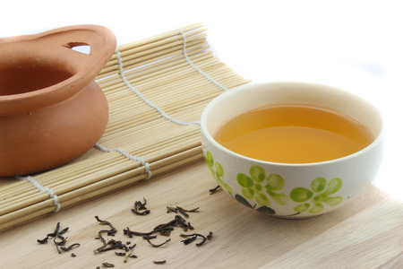 Tea in a cup and Clay pot with isolate  backgroundの写真素材