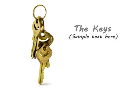 Gold keys isolated on white background
