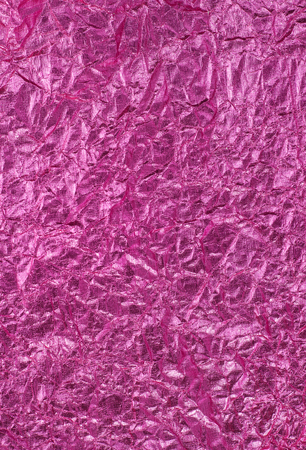 Texture of pink crumpled paper.の写真素材