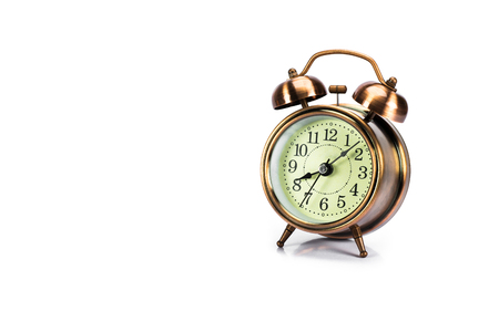 Old alarm Colck of copper color or rust color in isolate background.の写真素材