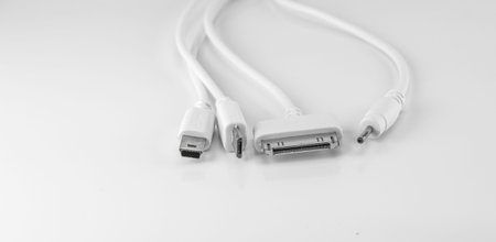 White wire usb mobile charging cable in white background.
