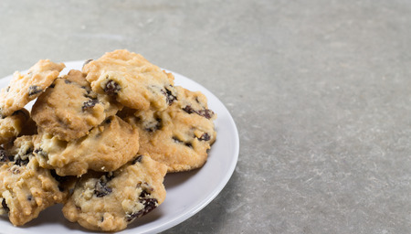 Chocolate chip cookie on white dish.の写真素材