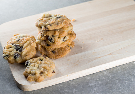 Chocolate chip cookie on wood plate.の写真素材